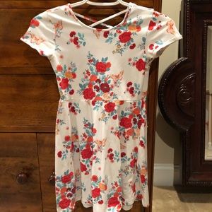 A floral dress with an X shape on the back